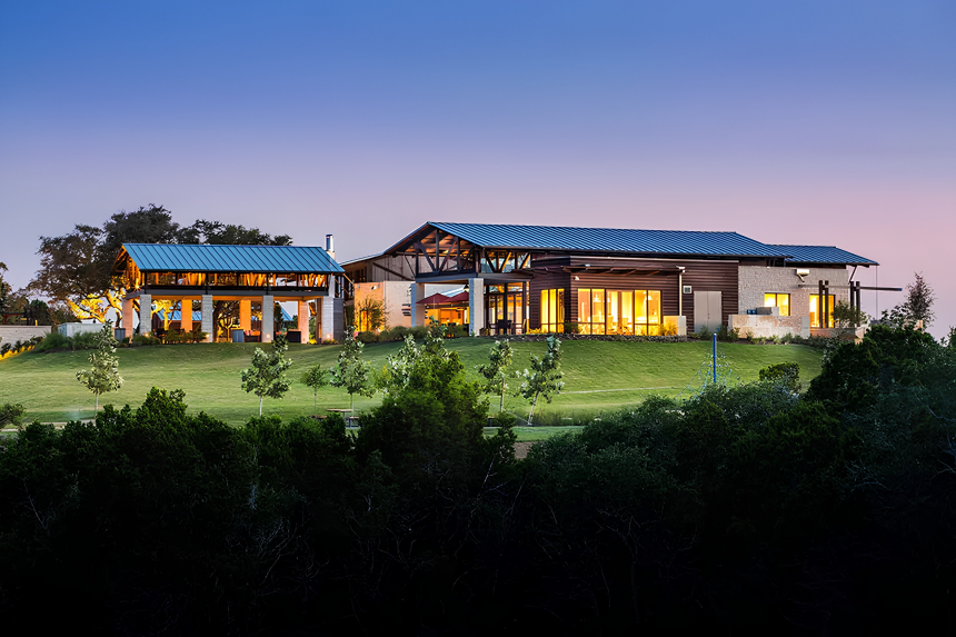 Hill Country estate home on acreage in Dripping Springs at twilight